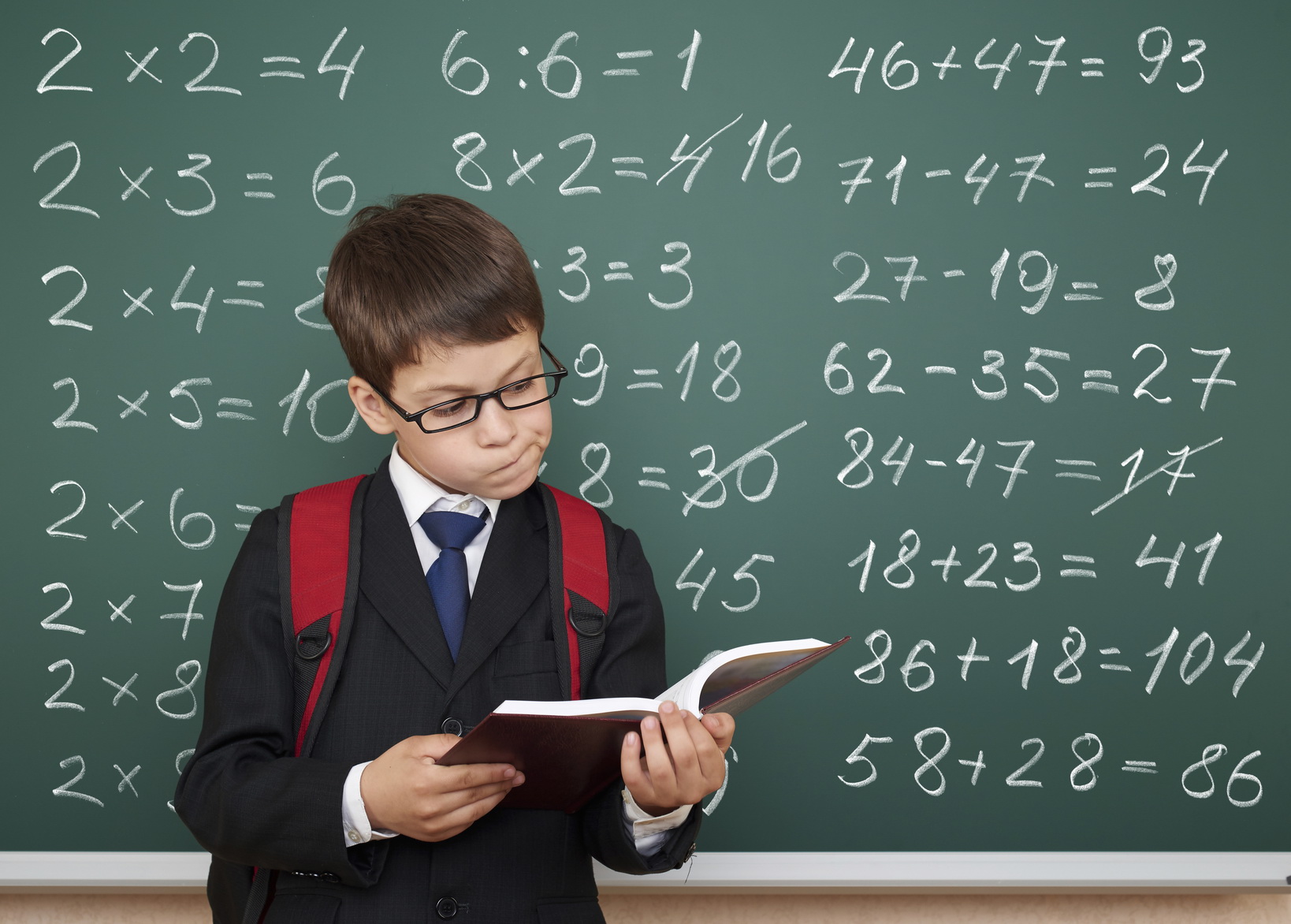 boy exercise math on school board